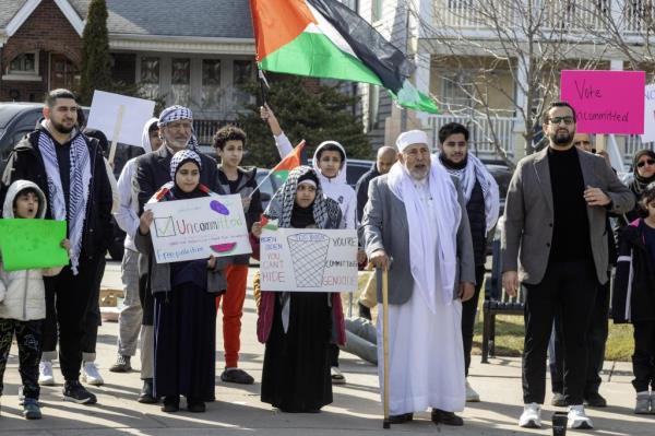 Two days ahead of Michigan's Presidential primary election, a rally in this heavily Arab-American city urges a vote for uncommitted instead of for Joe Biden. Abraham Aiyash (right), Majority Floor Leader in the Michigan State House of Representatives, joined the rally. Many Arab-Americans are furious a<em></em>bout Biden's support for Israel in the Gaza war.