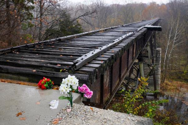 Flowers are placed at the Mo<em></em>non High Bridge, wher<em></em>e the video from Libby German's phone was taken.
