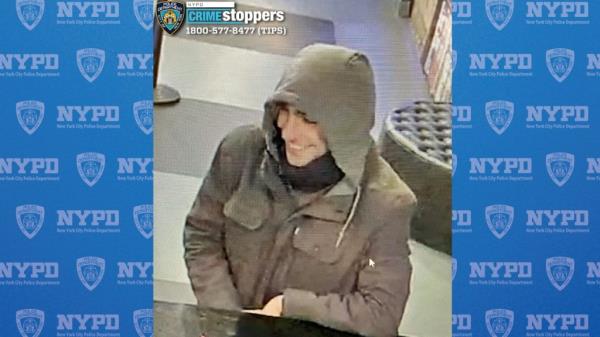 The suspect is seen in CCTV footage smiling and wearing a hoodie