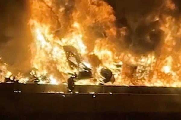 The semi-truck slammed into standstill traffic and burst into flames, killing four people and injuring at least 17