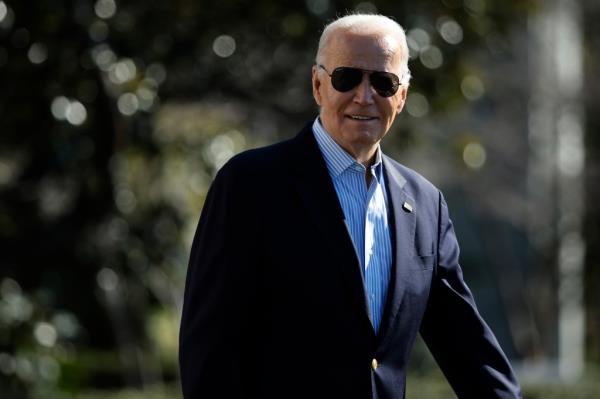 President Joe Biden walks across the South Lawn before boarding the Marine One presidential helicopter and departing the White House on February 29, 2024.