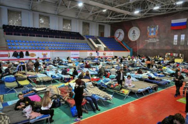 Mandatory Credit: Photo by ARKADY BUDNITSKY/EPA-EFE/REX/Shutterstock (12907588m) People rest in the temporary accommodation center for refugees from Mariupol and self-proclaimed Do<em></em>netsk People's Republic (DPR) in the sports school in Taganrog, Rostov region, Russia, 22 April 2022. In 91 temporary accommodation centers in the Rostov region lives 6057 people, including 2903 children. According to the Federal Security Service of the Rostov region, over the past day, a<em></em>bout 12.5 thousand refugees from Ukraine crossed the border of the Rostov region. On 24 February Russian troops had entered Ukrainian territory in what the Russian president declared a 'special military operation', resulting in fighting and destruction in the country, a huge flow of refugees, and multiple sanctions against Russia. Refugees from Mariupol in Rostov region, Taganrog, Russian Federation - 22 Apr 2022