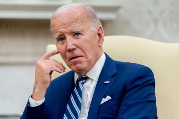 President Joe Biden holds a meeting in the Oval Office of the White House,