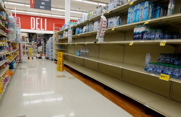 Nearly empty water shelves at a grocery store in Pinellas Park, Florida, as residents stock up in anticipation of Hurricane Idalia