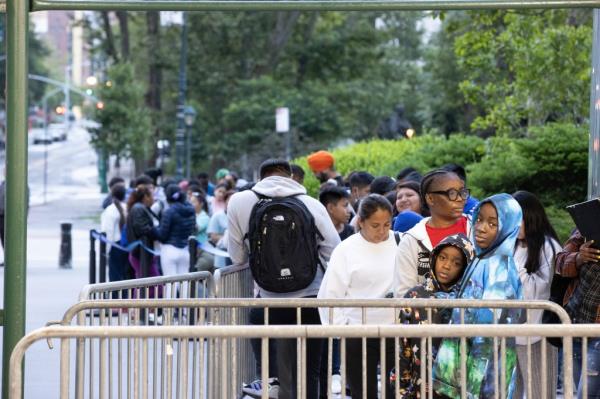 migrants waiting outside