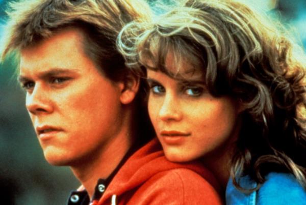 Kevin Bacon with Lori Singer. 