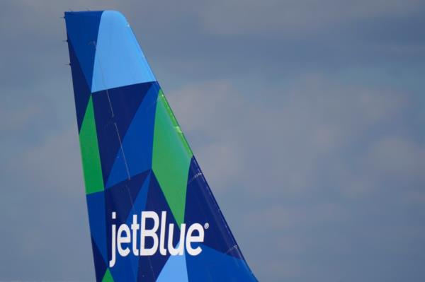 A photo of the tail of a JetBlue Airways Airbus A321.