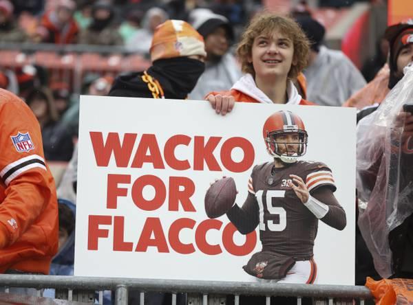Browns fans make a sign for Browns quarterback Joe Flacco on Dec. 17, 2023, at Cleveland Browns Stadium.