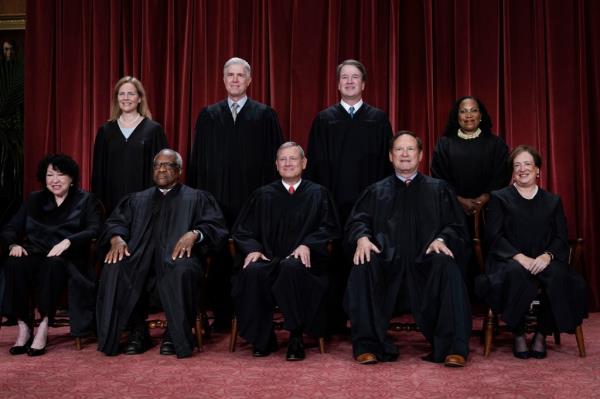 Members of the Supreme Court sit for a new group portrait in 2022.