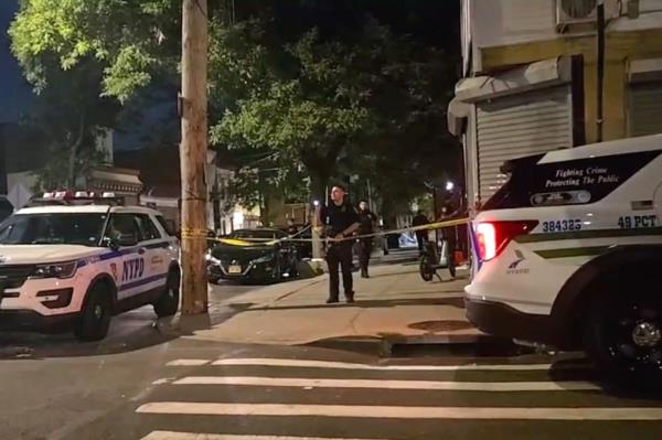 A photo of cops at the cordo<em></em>ned off Van Nest Avenue crime scene.