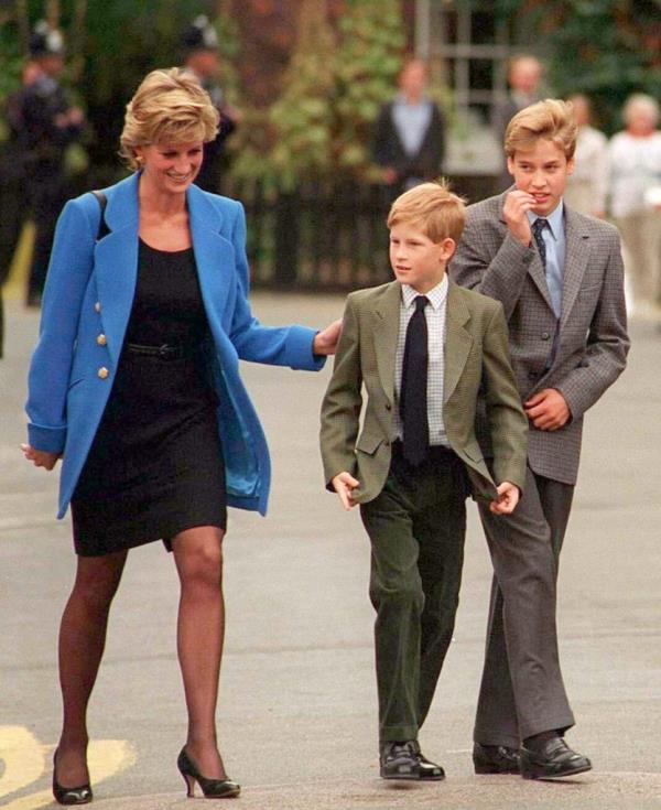 Princess Diana walking with her sons, Prince William and Prince Harry, on the day William joined Eton in September 1995