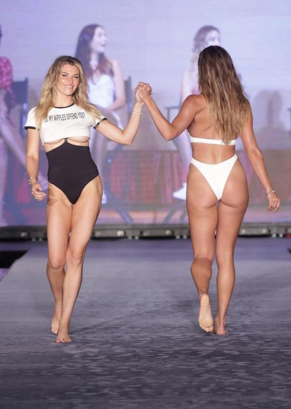 Samantha Hoopes and Penny Lane walk the runway during Sports Illustrated Swimsuit Show during Miami Swim Week